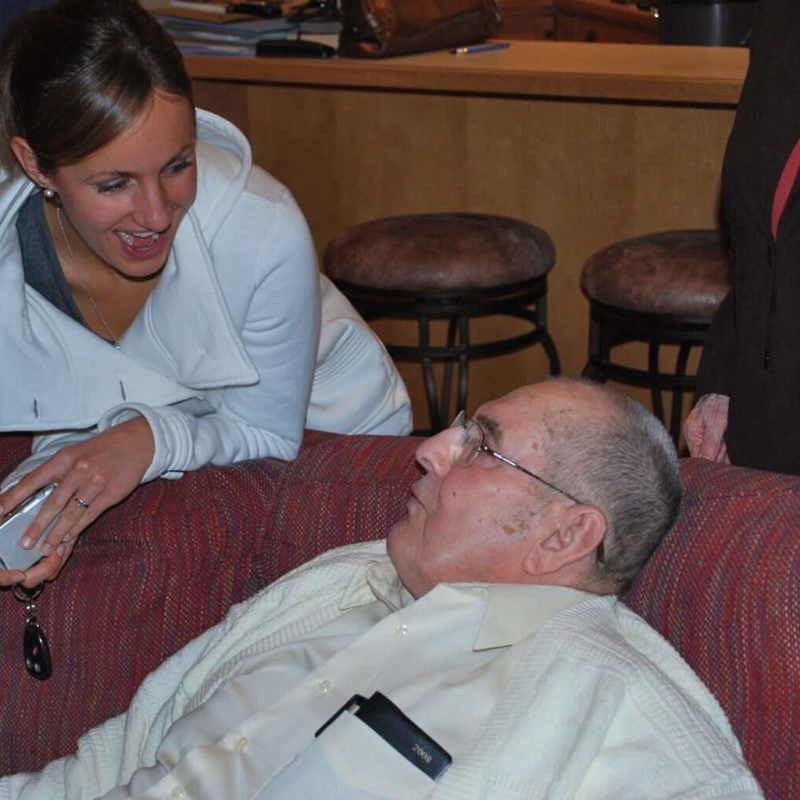 Lindsay and her grandmpa on the couch.