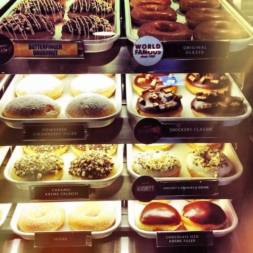 Shelves of donuts.