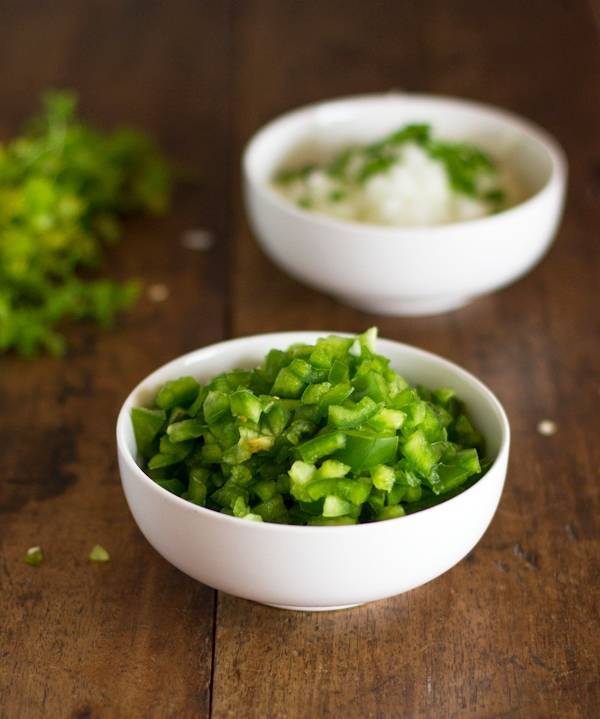 Cut peppers in a white bowl.