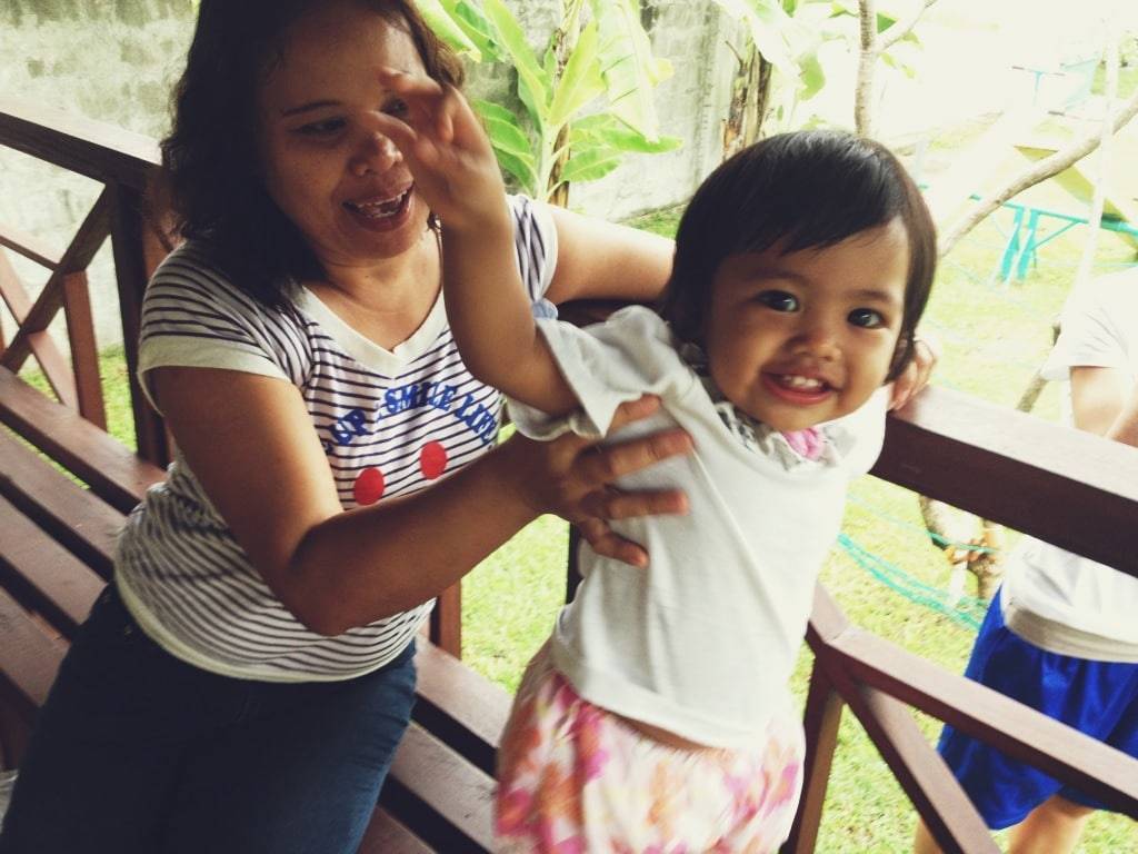 Woman holding a young girl.