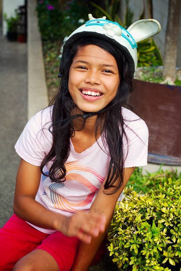 Young woman smiling at the camera.