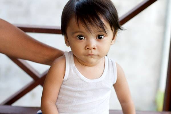 Young baby looking at camera.