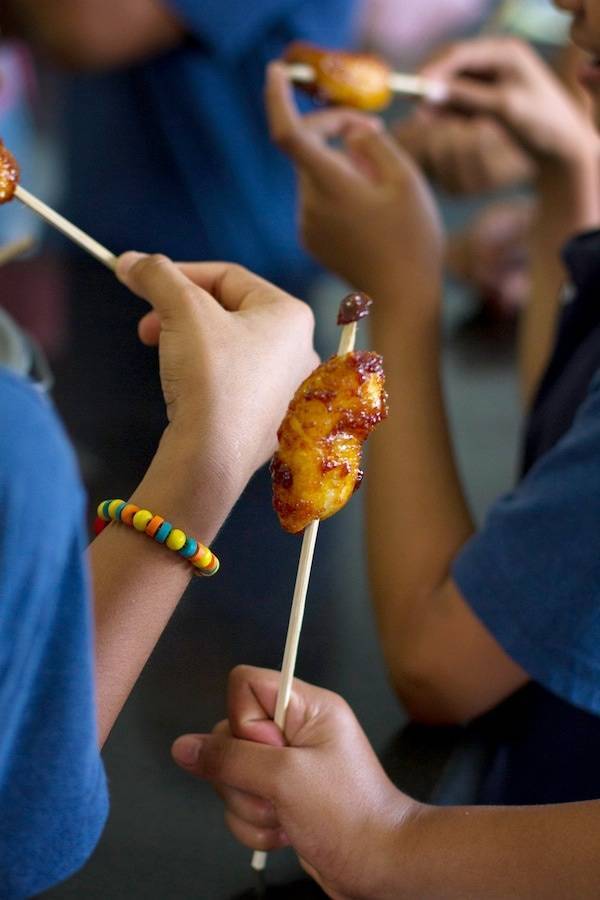 Bananas on skewers.
