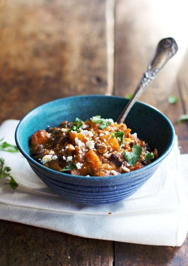 Jalapeño Sweet Potato Chicken Chili in a blue bowl with a spoon.
