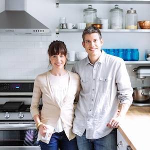 Man and woman smiling.