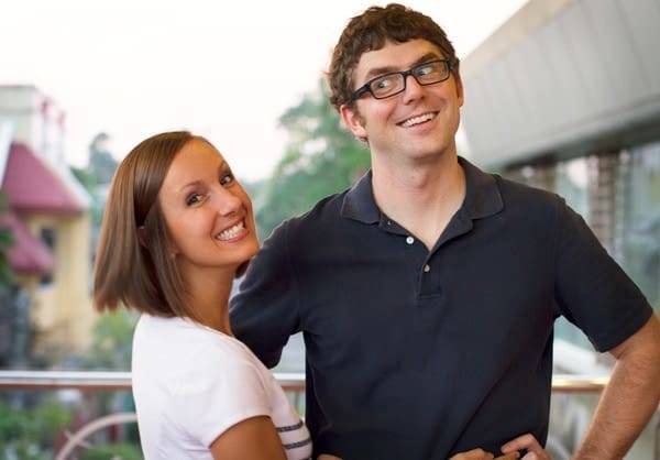 Man and woman smiling.