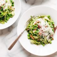 Pesto Asparagus Noodles in bowl with forks.