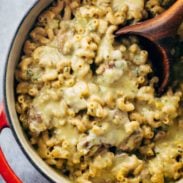 Steak and Cheddar Mac and Cheese in a pot with a spoon.