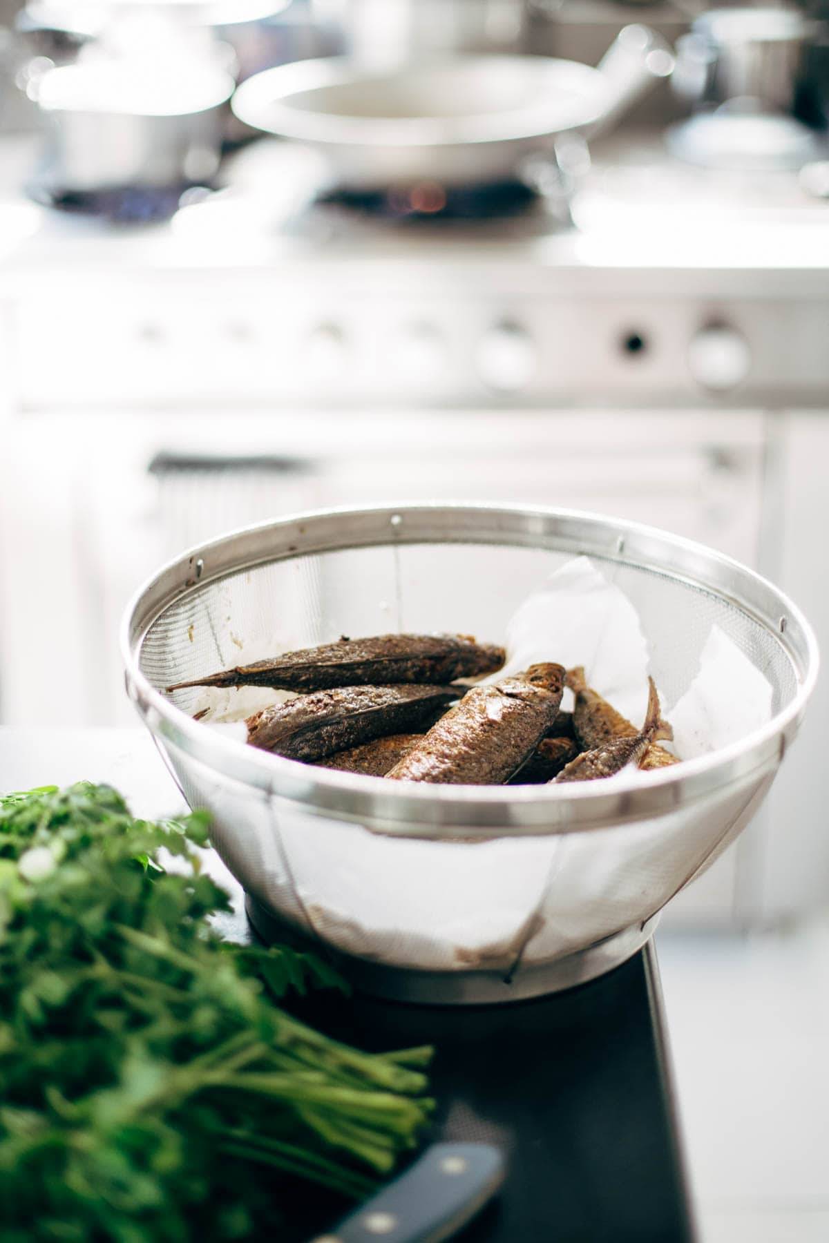 Fish in a strainer.