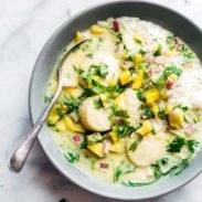 Green Curry Scallops in a bowl with a spoon.