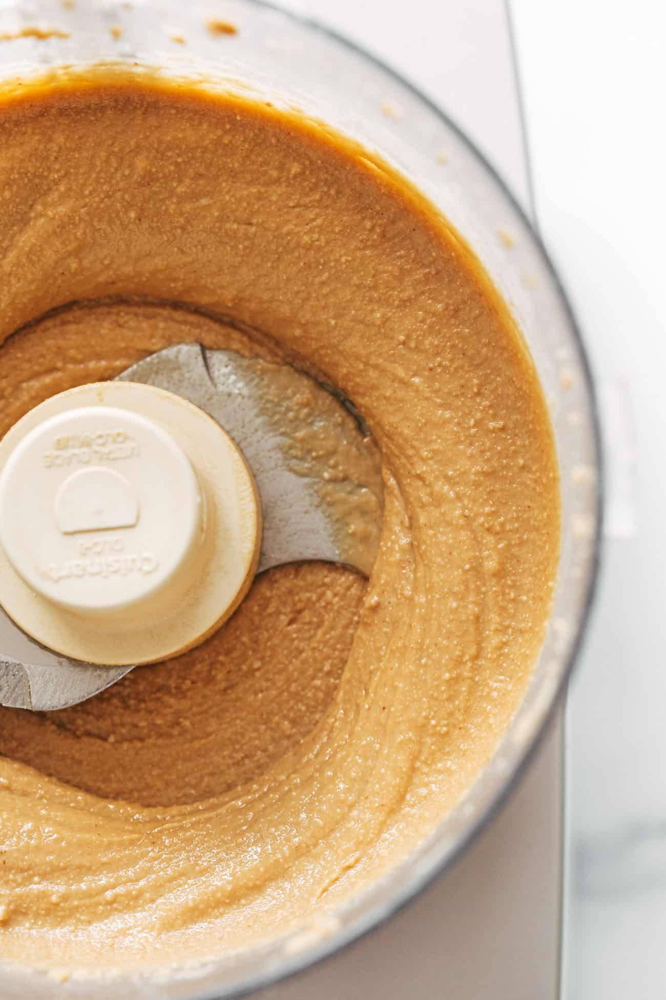 Peanut butter being processed in food processor