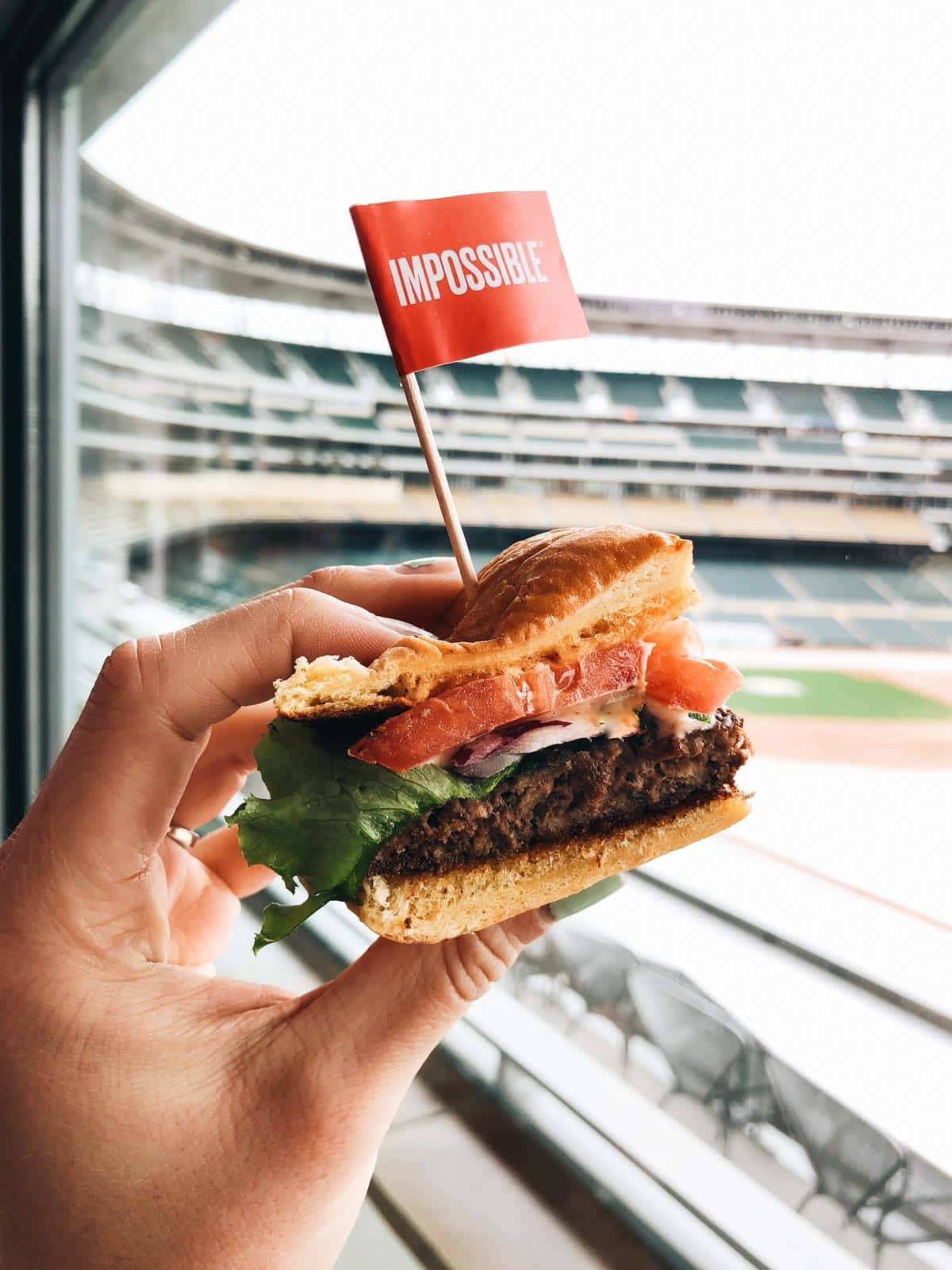 Burger with a red flag with impossible written on it.