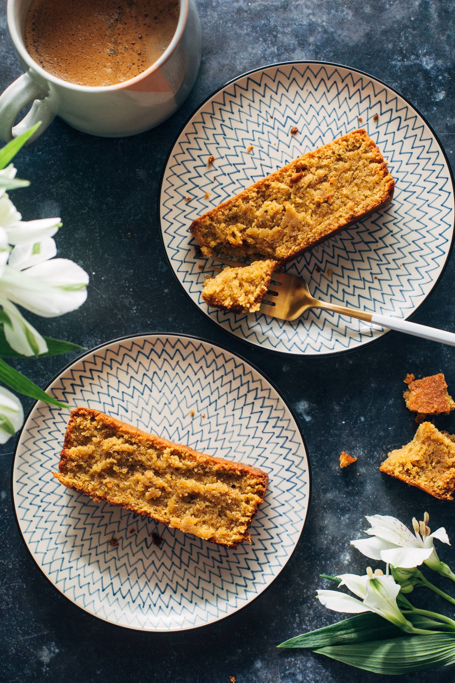 Taking a bite of a slice of pistachio loaf.