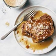 Pumpkin Bread French Toast on a plate with syrup.
