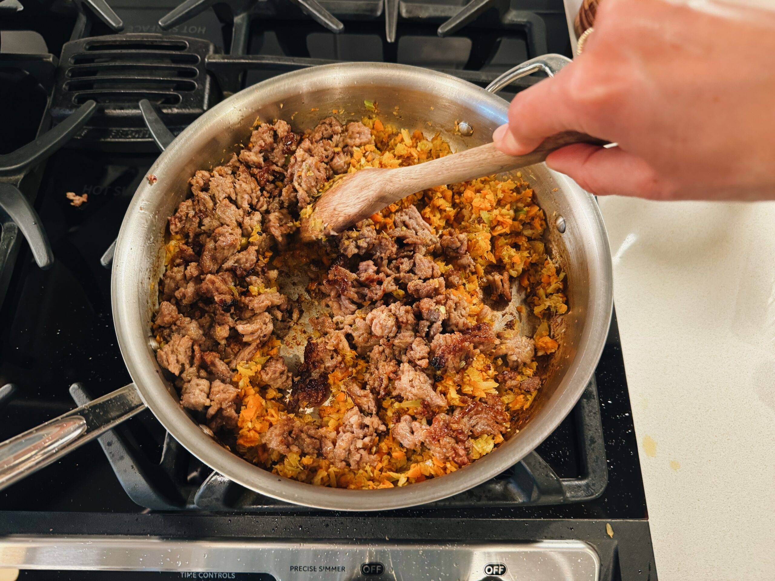 Browning veggies with sausage.