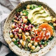 Winter Spa salad in a bowl with chickpeas, avocado, and oranges.