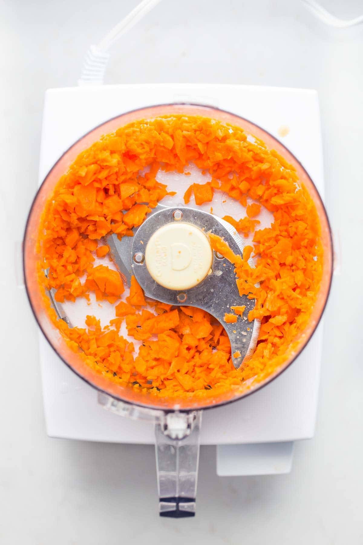 Carrots in a food processor.