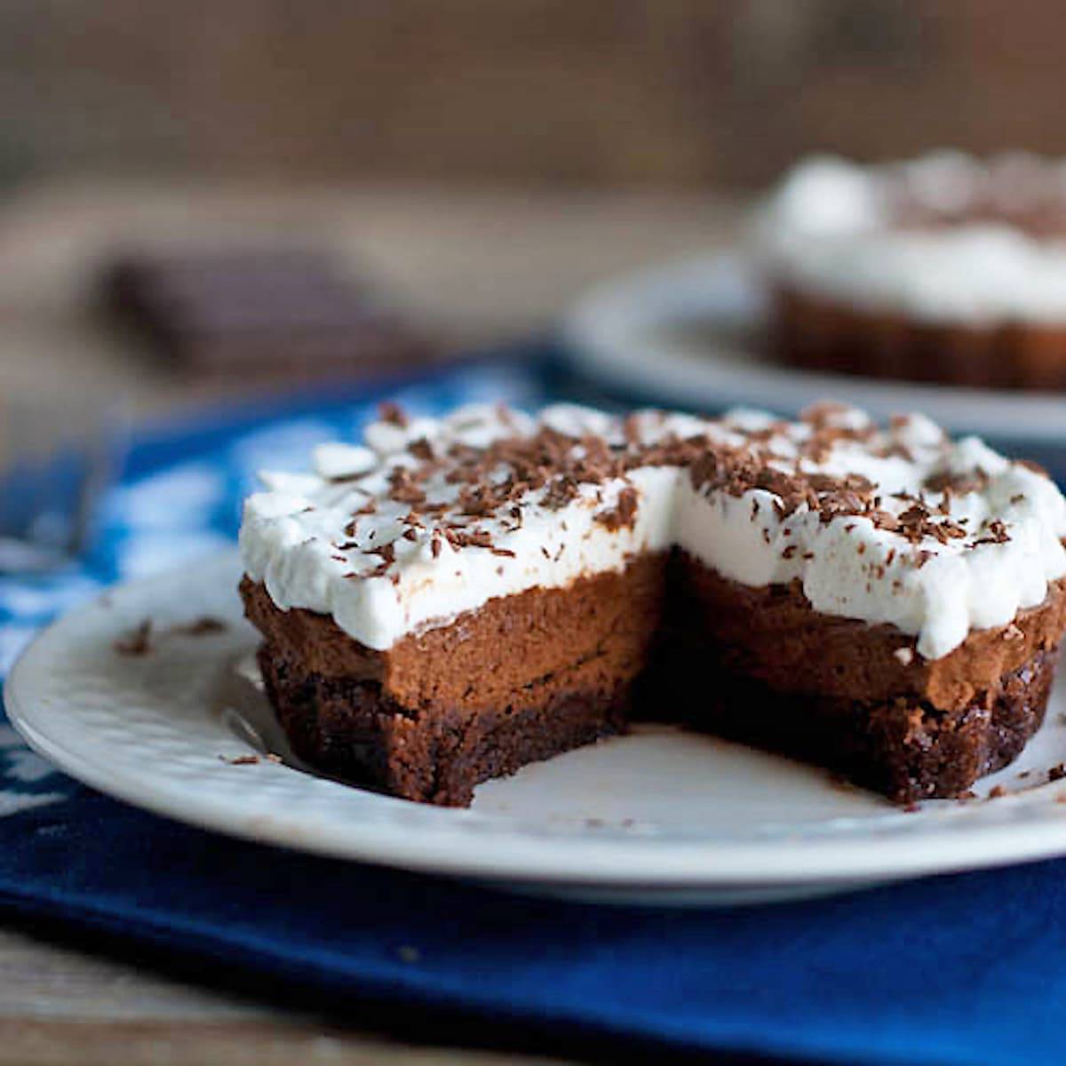 French silk brownie pie with pieces removed.