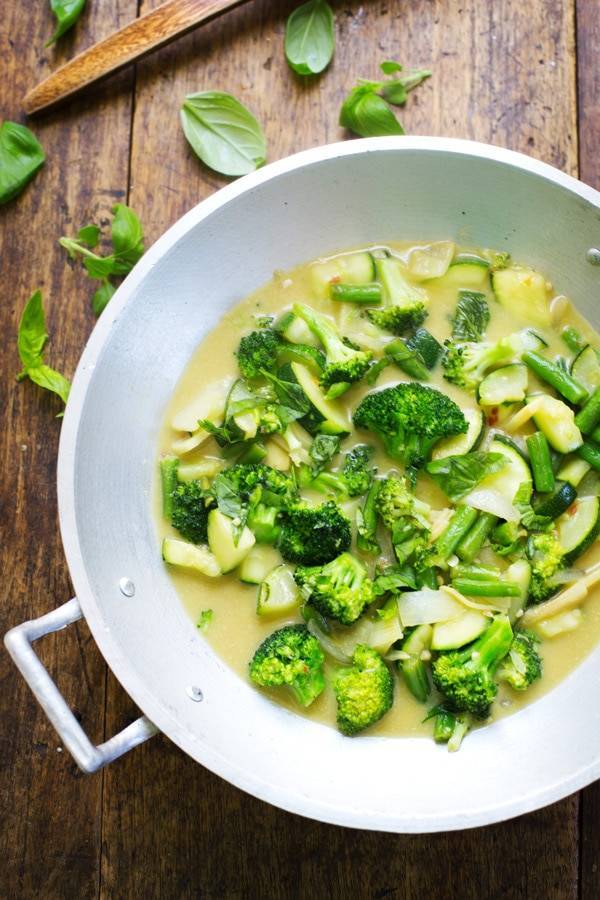 Green curry in a skillet.