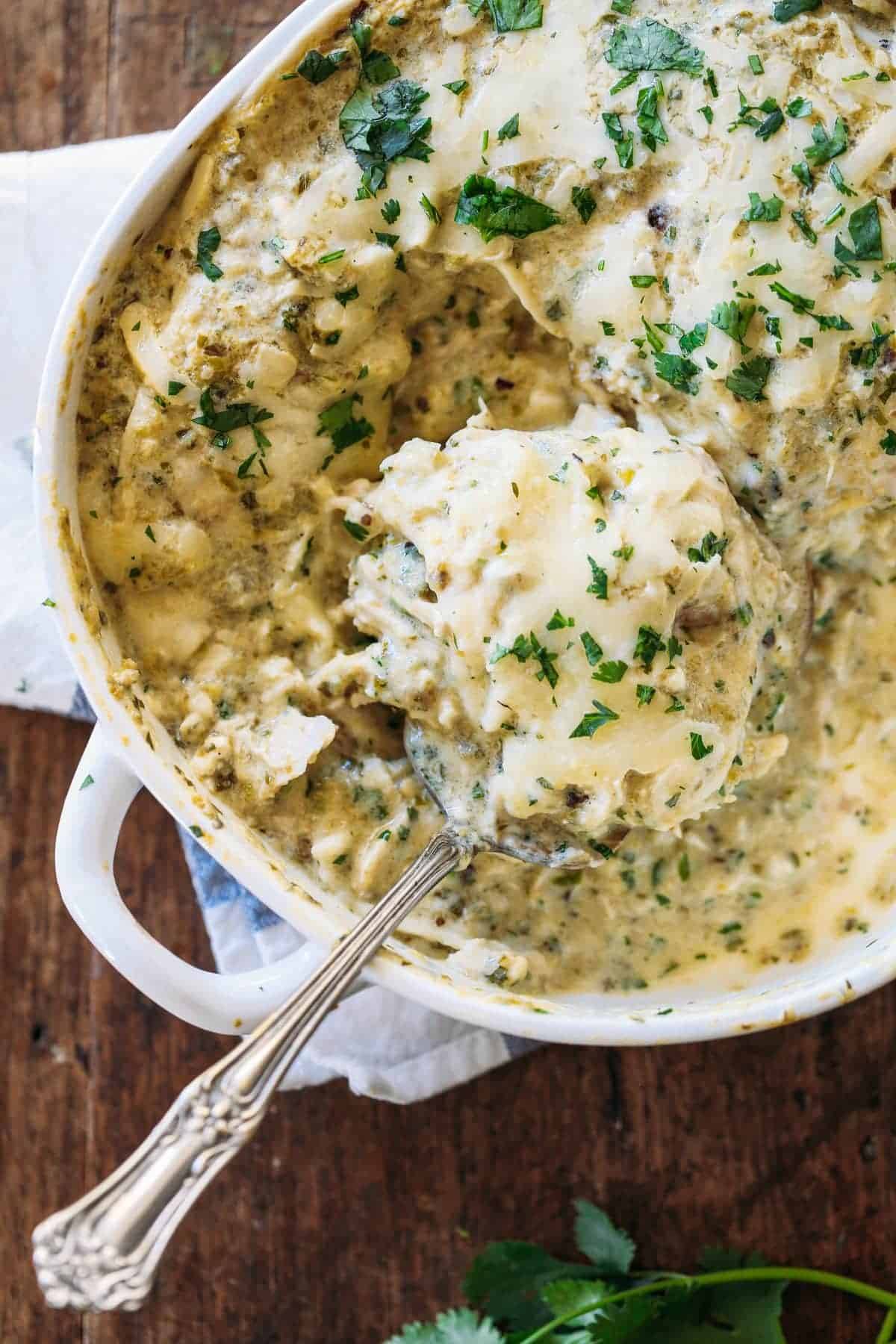 Roasted Tomatillo Chicken Enchilada Casserole - with a homemade spicy sauce and lots of cheese. 400 calories. | pinchofyum.com #chicken #enchilada #casserole