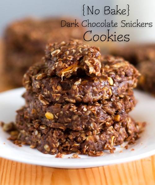 No-bake Snickers cookies stacked on each other on a white plate.